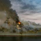 Boats combat a fire on board the US Navy amphibious assault ship USS Bonhomme Richard. Photo: U.S...