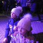 Thea (7, front) and Riley (9) Dickey take in some of the music on offer at Light Up Winter in...