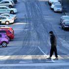 A man crosses an icy Union St in Dunedin yesterday.  Photo by Peter McIntosh.