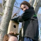 Zita Young helps her daughter Amy  put up the bird box she made during a recent West Otago Rural...