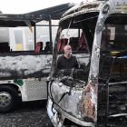 Good Company Tours owner and operator Richard Trainor looks at the damage done after two of his...