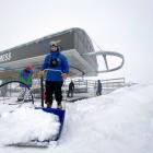 Hugo Huntington from the lifts crew at Coronet Peak removes snow at the ski resort yesterday....