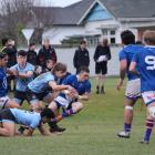 Southland Boys’ first five-eighth Kaea Nikora-Balloch is tackled by King’s openside flanker Jay...