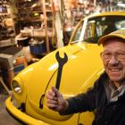 Mechanic Ken Berry displays his German-made Volkswagen Beetle, lovingly rebuilt over 16 years.