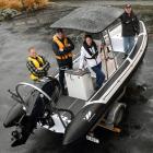 Showing off a new club rescue boat are Macandrew Bay Boating Club members (from left) club...