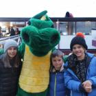 Maggie, Finn and Sam Langford enjoy being greeted by Pot the Dragon before boarding TSS Earnslaw....