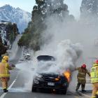 A couple from Mosgiel managed to get out of their car before it burst into flames in Stanley St,...