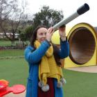Greater Green Island Community Network worker Larna McCarthy looks through a telescope in the...