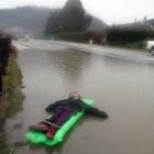 A floating dummy tethered to a fence next to the floodwaters on Aubrey Rd amused drivers and...