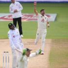 England seamer James Anderson celebrates taking his 600th test wicket — that of Azhar Ali, of...