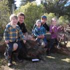 Clyde hunters (from left) Walter Horrell (4), dad Jarod Horrell with a 79.2kg boar, Hunter...