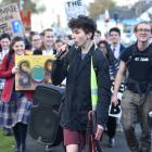 Zak Rudin leads young climate change activists as they march from the Museum Reserve to Labour MP...