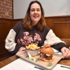 Dine Dunedin director Nicola McConnell prepares to tuck into a karaage chicken burger at Salt Bar...