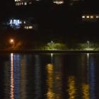 Two new LED streetlights (the fourth and fifth from the left) emit a brighter and bluer light in...