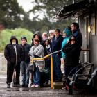 Passengers waiting in the rain for the Deans Ave park and ride. Photo: Martin Hunter