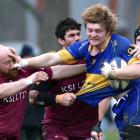 Taieri loose forward Nick Henderson charges forward against Alhambra-Union at the North Ground on...