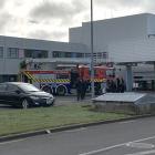 A reporter at the scene saw crowds of people standing outside the back and front entrances to the...
