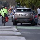 A cyclist is seen going around cars parked over the cycle lane on Great King St on Wednesday...
