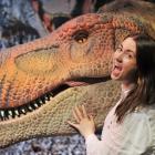 Otago Museum exhibition and creative services officer Shanaya Allan shows off the animatronic...