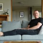 Ultramarathon runner Glenn Sutton puts his feet up at home yesterday after a long run from...