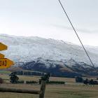 Snow blankets the hills near Middlemarch yesterday, putting out the fire that burned the night...