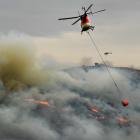 At one point, seven helicopters were tackling an out-of-control burn-off near Macraes yesterday....