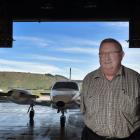 Mainland Air owner Phil Kean with one of the flight school’s planes in the hanger at Dunedin...