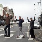 Port Chalmers residents (from left) Jonathan Holloway, Pete Cole and Robert Scott celebrate a...