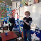 Enviroschools Otago regional co-ordinator Robyn Zink has a pair of undies to be used in the soil...