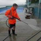 St Clair Hot Salt Water Pool duty supervisor Tait Familton prepares the pool for its opening day...