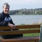 Dunedin Marathon organising committee chairwoman Maria Sleeman sits on the edge of Otago Harbour,...