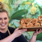 Blend Espresso’s Helena Findlay (24) shows some of the cheese rolls Judith Collins missed out on...