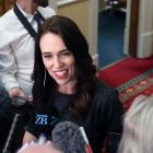Prime Minister Jacinda Ardern talks to reporters at Parliament in Wellington. Photo: Getty