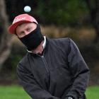 Ryan Bellamy, of Port Chalmers, pops up a bunker shot to ‘‘gimme’’ distance on the 4th green...
