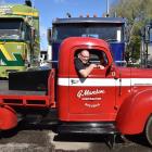 Graham Mason, of Rotorua, in his 1947 International KB-1 flatbed truck, which he is driving...