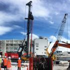 March Construction workers prepare for a test pile to be drilled at the new Dunedin Hospital site...