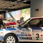 Transport World workshop team member Darren Robbie inspects a Mazda 323 4WD, one of the...