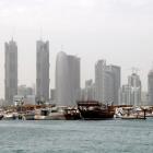 Traditional fishing Dhows are seen in port near modern glass and steel buildings on the Doha skyline. Photo: Reuters