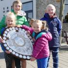 Posing with the Ranfurly Shield in Queenstown yesterday are (from left) Liliana McGregor (8), Max...