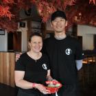 Gillian and Yuya Sugiyama with a bowl of ramen in their Takeichi Ramen restaurant that opened...