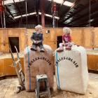 Cousins Jacob McRae and Tessa Cameron (both 2), of Mokoreta, sit on the top of wool bales. The...