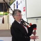 Myra Wells, of Abbotsford, pipes in the haggis at the New Zealand Trillium Group’s lunch on...