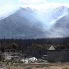 Smoke drifts across the Ohau area yesterday afternoon as the fire continues to burn. PHOTOS:...