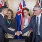 Greens co-leaders James Shaw and Marama Davidson and Labour leader Jacinda Ardern and deputy...