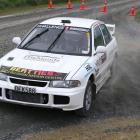 Andrew Graves, of Gore, punts his Mitsubishi EVO 3 around the tight Cairns Rd-Roberts Rd...