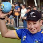 Shilo Hogg (11) is introduced to bowls at the Taieri Bowling Club’s bowls3five tournament. PHOTO...