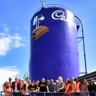 Those on the last tour through the former Cadbury factory stand next to the Cadbury silo. PHOTO:...