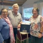 Di Yates, left, with Sandy and Charles Wiffen, and one of the boxes of sauvignon blanc she...