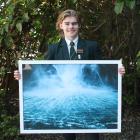 Aparima College pupil Dom Riddell displays one of the photographs he took at Milford Sound. PHOTO...