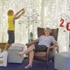 Ali Jarvis (left) and Yeverley McCarthy prepare Santa's Grotto for his arrival at the Wanaka...